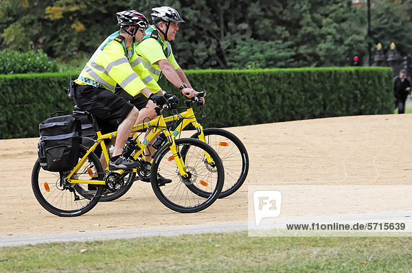 Two police officers on bicycles  bicycle patrol  in Hyde Park  London  England  United Kingdom  Europe