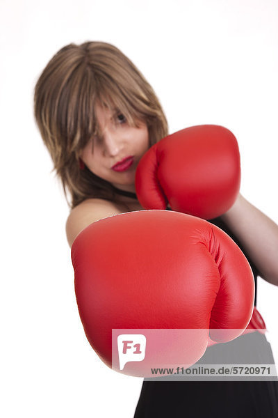 Young woman with red boxing gloves  portrait