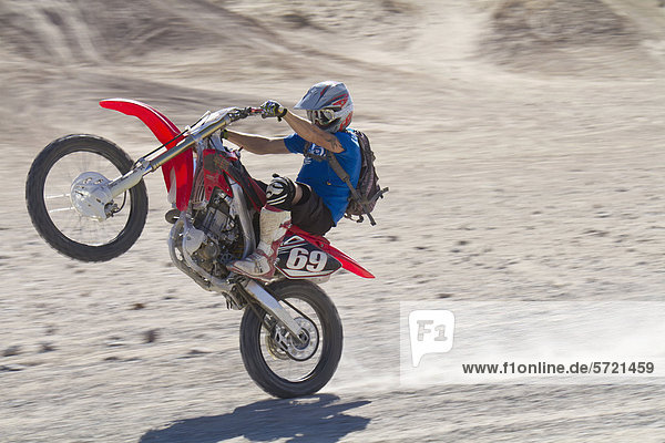 USA  California  Motocrosser performing wheelie on Palm Desert