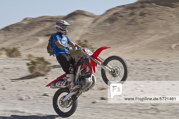 USA  California  Motocrosser performing wheelie on Palm Desert