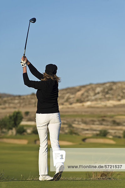 Cyprus  Woman playing golf on golf course