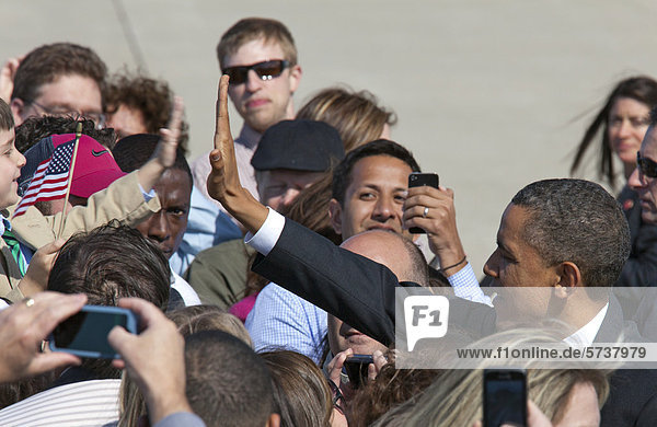 President Barack Obama greets a crowd of supporters upon arrival at Detroit Metro Airport on Air Force 1  Detroit  Michigan  USA