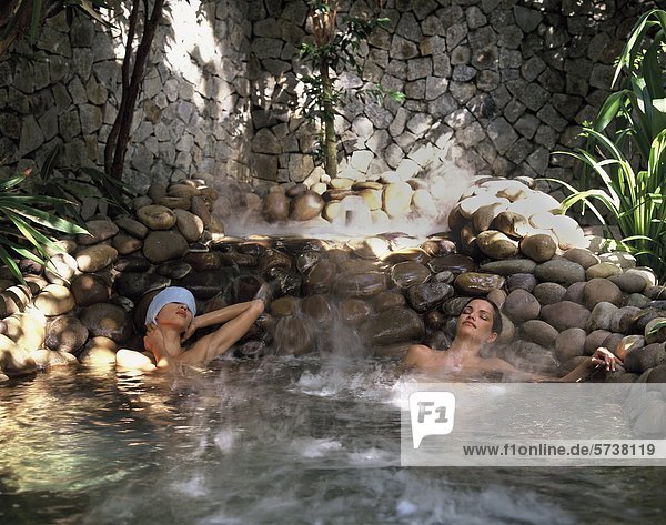 Malaysia  Pangkor Laut  women relaxing in a thermal pool                                                                                                                                            