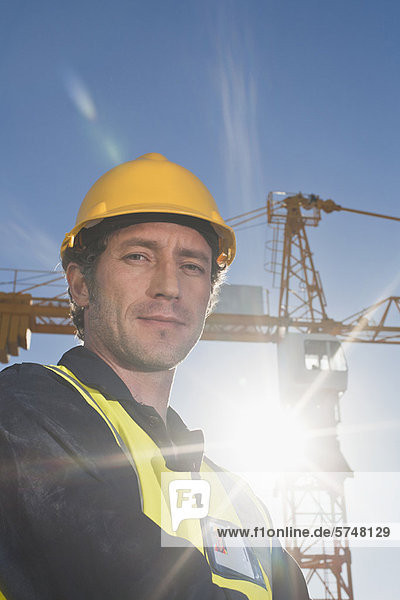 Worker standing at construction site