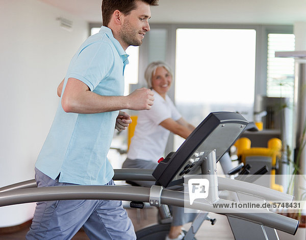 Man using treadmill in gym