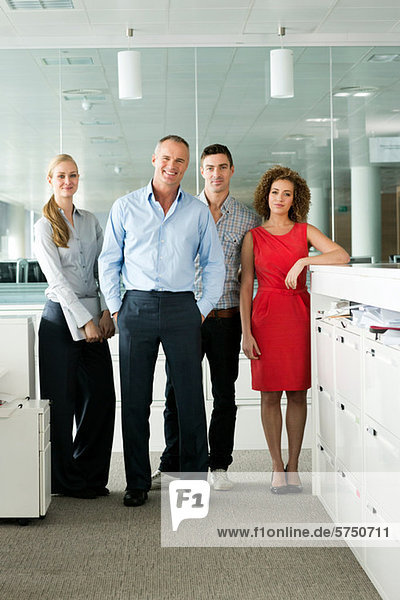 Portrait of colleagues in office  smiling