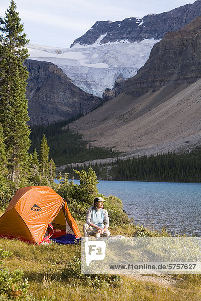a woman camping  Bow lake  banff national park  alberta  canada.