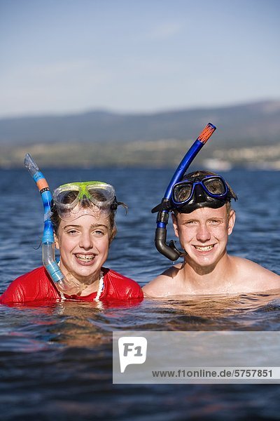 Teenagers snorkeling in Okanagan lake  British Columbia  Canada