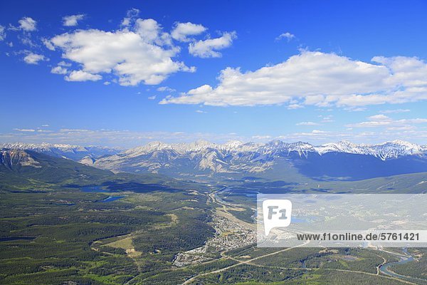 An aerial view of the town of Jasper in the forest valley of the Athabasca River with the Colin Range of mountains  Jasper National Park  Alberta  Canada