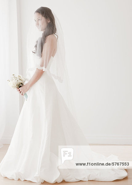 Mixed race bride in wedding dress