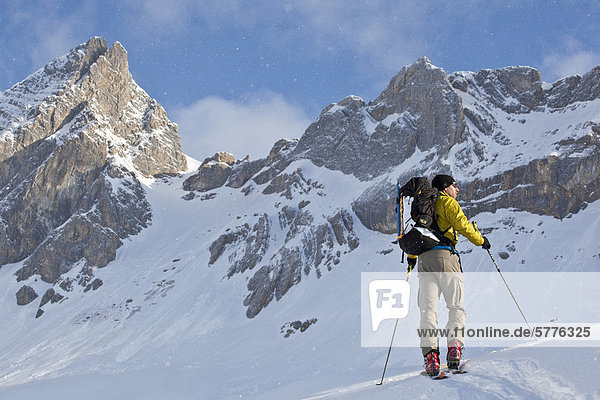 A man ski touring while on a backcountry ski hut trip in the canadian rockies near Golden  British Columbia  Canada