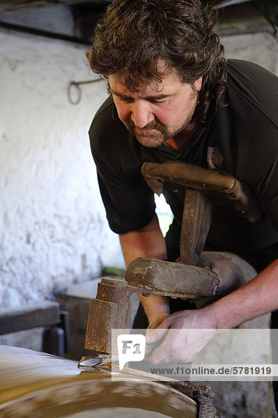 Forgemaster Frank Wagenhofer at work  blacksmith  historic forge at Burghausen  Upper Bavaria  Bavaria  Germany  Europe