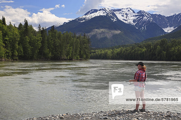 Young girl fishing  Skeena river  British Columbia  Canada