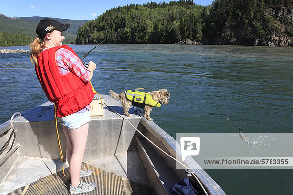 Young girl catching bull trout  Skeena river  British Columbia