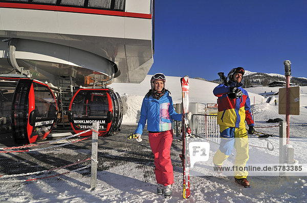 Skiers  gondola lift or cable car  Winklmoos-Alm skiing area  Chiemgau region  Bavaria  Germany  Europe