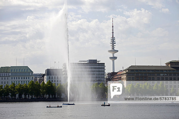 Binnenalster or Inner Alster Lake with rowing boats in front of the Heinrich-Hertz Tower  television tower  Free and Hanseatic City of Hamburg  Germany  Europe