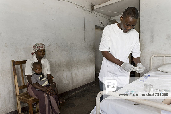 HIV-positive mother having her son tested for HIV-AIDS  clinic in Quelimane  Mozambique  Africa