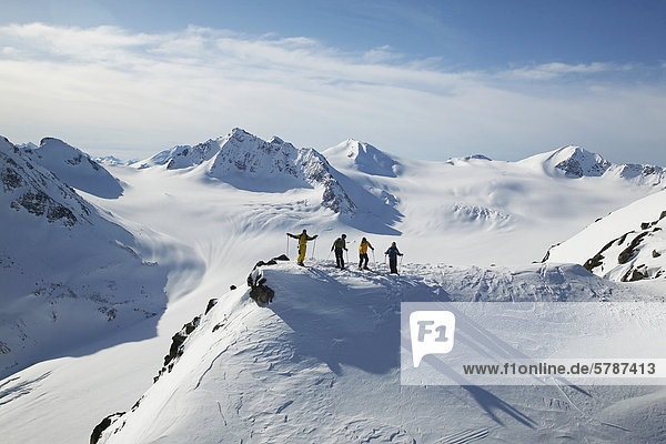 Skiers ready to take a run in the back country of whistler blackcomb  British Columbia  Canada.