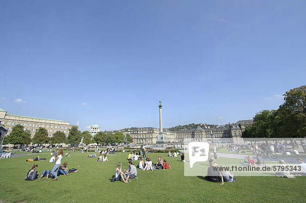 People on Schlossplatz square with the 30-meter high Jubilaeumssaeule column Stuttgart Baden-Wuerttemberg Germany Europe