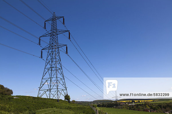 Electricity pylon against blue sky  Hampshire  England  United Kingdom  Europe
