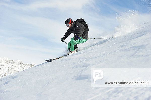 Skier skiing on snowy slope