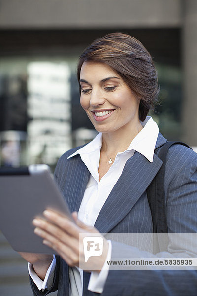 Businesswoman using tablet computer