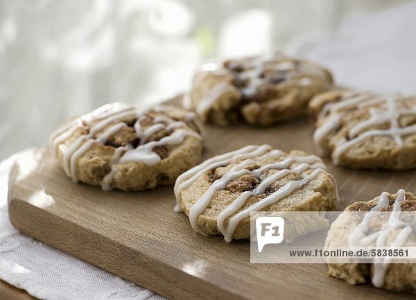 Cinnamon Scones with Icing on Cutting Board