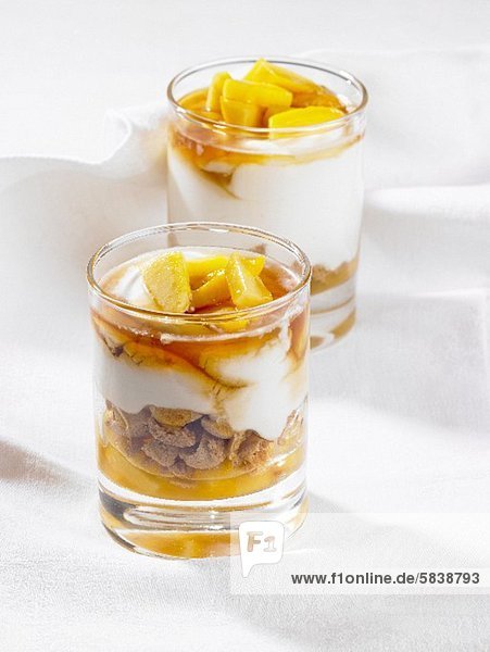 Layered deserts with Mango  yogurt and amarettini