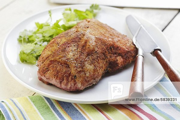 'Seasoned Pork Roast on a White Platter