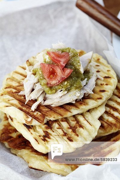 Grilled Naan Topped with Pulled Pork  Salsa Verde and Tomato