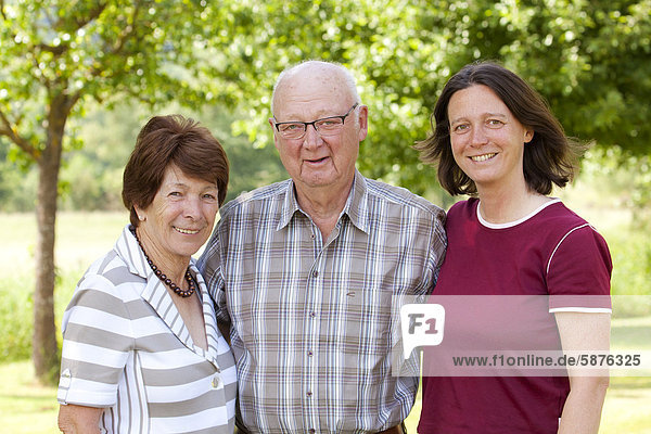 Elderly couple  retirees  70-80 years old  with their daughter  40-50 years old  Bengel  Rhineland-Palatinate  Germany  Europe
