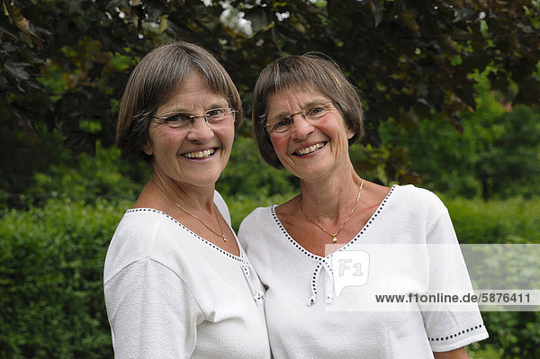 Two sprightly twin sisters  portrait