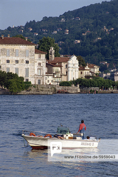 Small boat on Lake Maggiore with Isola Bella beyond  in Piemonte  Italy  Europe