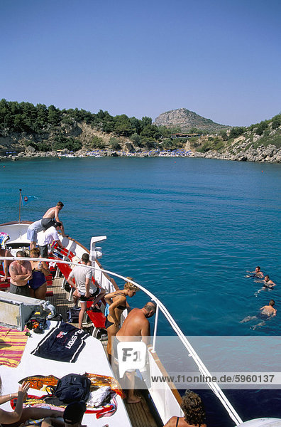 Boat trippers  east coast  Anthony Quinn's Bay  Rhodes  Greek Islands  Greece  Europe