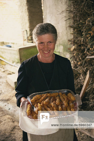Lady with homemade churros  Lugo  Galicia  Spain  Europe
