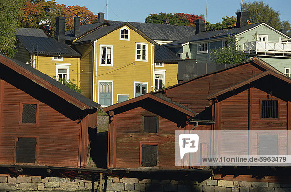 Typical heavy red of fishermen's cottages and sheds lining the River Porvoo  Porvoo (Borga)  Finland  Scandinavia  Europe