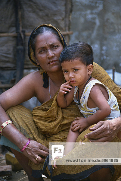 Mother and son in a slum in Dhaka  Bangladesh  Asia