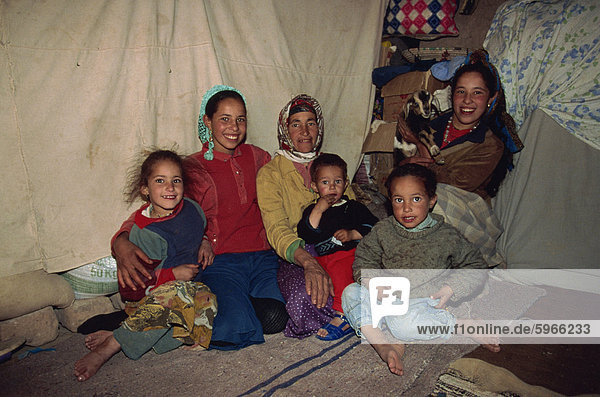 Portrait of a Berber family  women and children  inside a tent in the desert  southern Morocco  North Africa  Africa