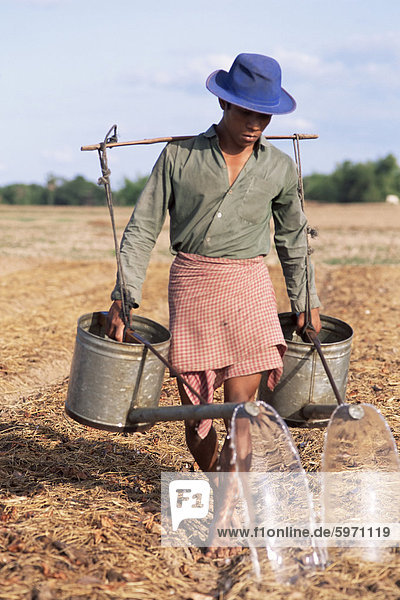 Farmer with watering cans  Cambodia  Indochina  Southeast Asia  Asia