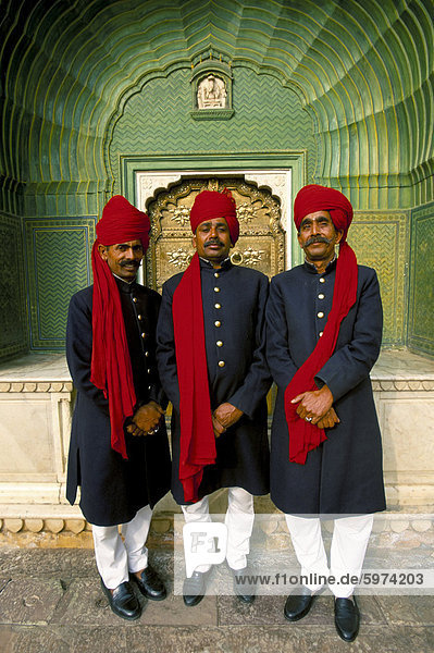 Palace guards in turbans at the ornate Peacock Gateway  City Palace  Jaipur  Rajasthan state  India  Asia