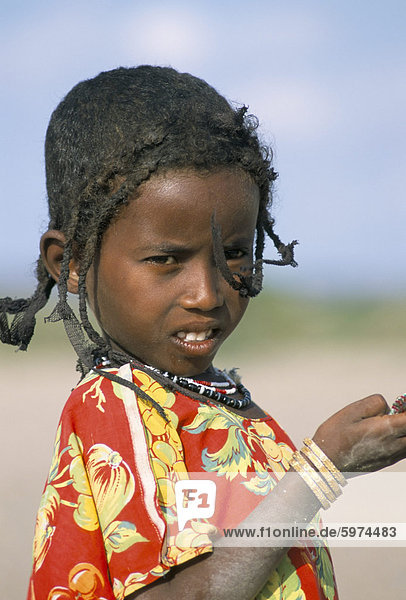 Portrait of an Afar girl  daughter of desert nomad  Afar Triangle  Djibouti  Africa