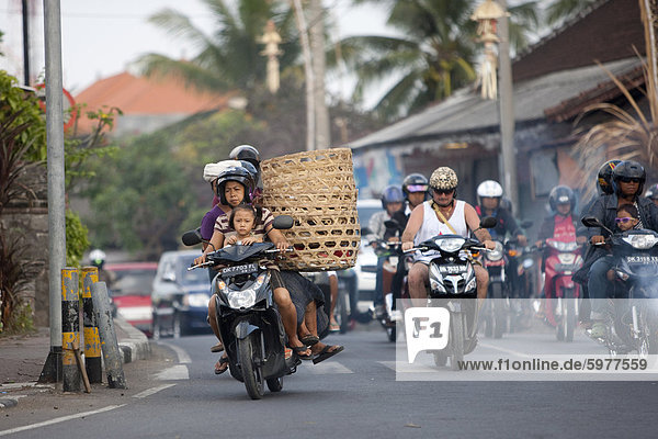 Motor cycles in traffic  Kuta  Bali  Indonesia  Southeast Asia  Asia