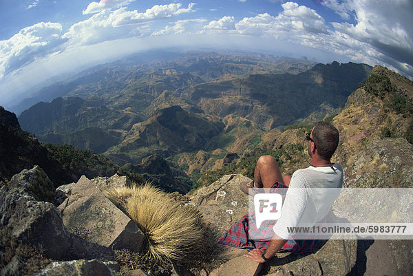 Tourist viewing breathtaking views at 14000 ft  Simien Mountains  Ethiopia  Africa