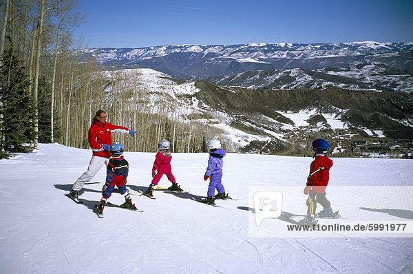 Children learning to ski at Snowmass  near Aspen  Colorado  United States of America  North America