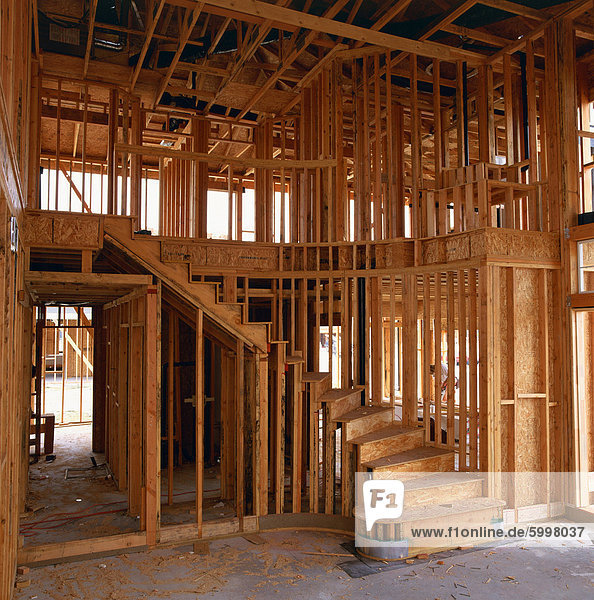 Interior of a wood framed house under construction in California  United States of America  North America