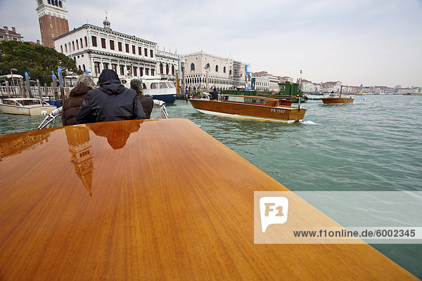 Traditional wood construction tourist boats on Grand Canal  Venice  UNESCO World Heritage Site  Veneto  Italy  Europe