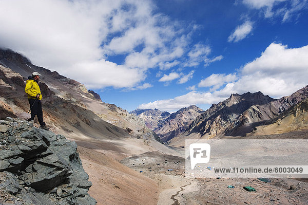 Hiker looking down to base camp  Plaza de Mulas  Aconcagua Provincial Park  Andes mountains  Argentina  South America