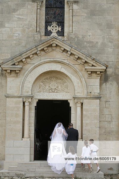 Bride walking into church  Montcalm  Gard  France  Europe