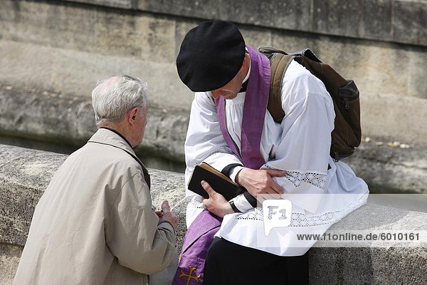 Holy confession at a traditionalist Catholic pilgrimage  Paris  France  Europe