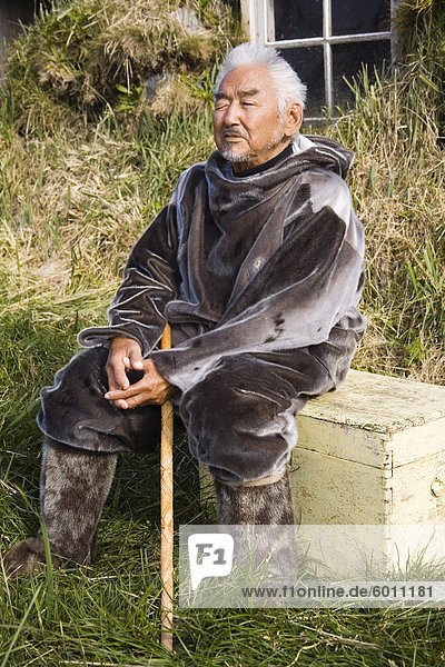 Native man wearing seal skin clothing  Museum in Nanortalik Port  Island of Qoornoq  Province of Kitaa  Southern Greenland  Kingdom of Denmark  Polar Regions